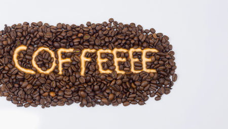 Coffee beans with word Coffee isolated on white background, clipping path includedの写真素材