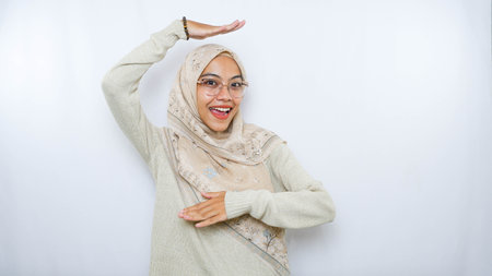 Portrait of young beautiful asian muslim woman with white background.