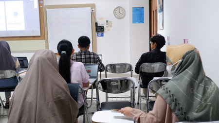 Yogyakarta, Indonesia - October 21st, 2023. Group of students attending class in the classroom....