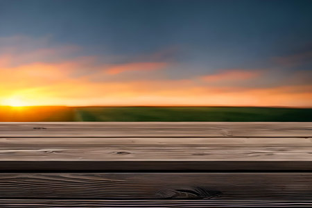 Wooden table in front of a beautiful sunset. Collage.の写真素材