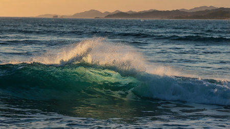 big wave on the beach at sunset, photo as a background, digital image