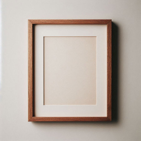 Wooden frame on a white wall. Minimalistic design.の写真素材