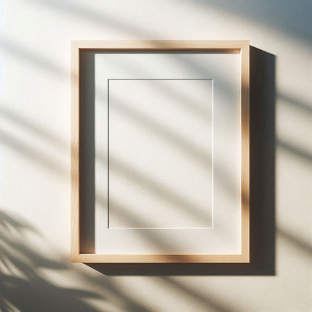 Blank picture frame on white wall with shadow overlay. 3D renderingの写真素材