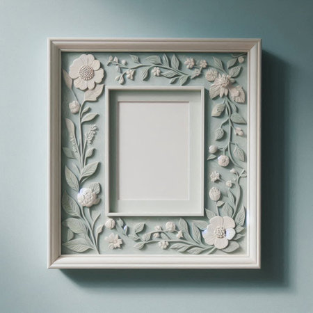 White picture frame on blue wall with floral ornament. Mock up template