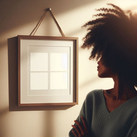 Silhouette of a young woman with afro hairstyle looking at the windowの写真素材