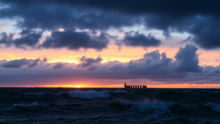 Baltic sea at sunset. Dramatic sky, glowing clouds, waves and pier