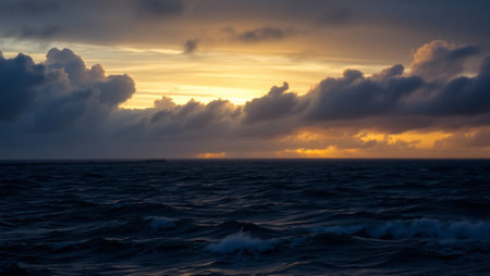 Beautiful sunset over the sea. Dramatic sky, waves and clouds.の写真素材