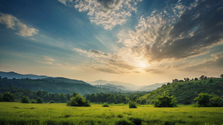 Sunset in the mountains. Landscape with green meadow and blue skyの写真素材