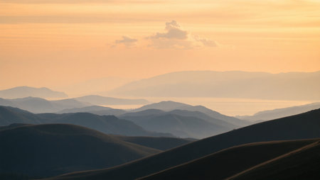 Sunset landscape with mountainsの写真素材
