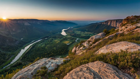 Panoramic view from the top of the mountain to the valley and river at sunset.