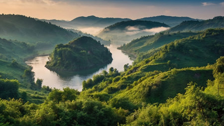 Foggy landscape with the river and mountains in the background.