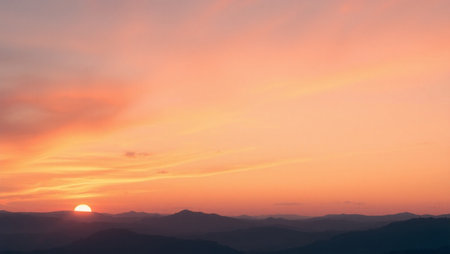 Beautiful sunset in the mountains with colorful sky and cloud background.の写真素材