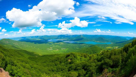 Mountain landscape with lake and forest on a sunny summer day.の写真素材