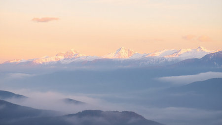 Mountains in the clouds at sunset.の写真素材