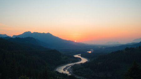 Sunset in the mountains with a view of the river and forestの写真素材
