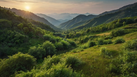 Mountain landscape with green meadows and sunset in the background.の写真素材