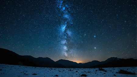 Milky way over the mountains in winter. Night sky with stars and milky way