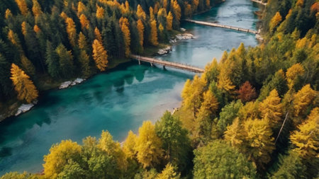 Aerial view of a wooden bridge over the mountain river. Beautiful autumn landscape.