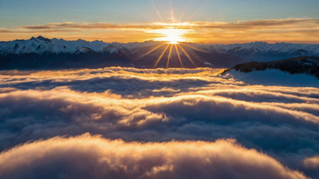 Beautiful sunset above clouds in the Alps. Panoramic view