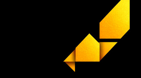 yellow paper origami arrow on black background with space for your textの写真素材