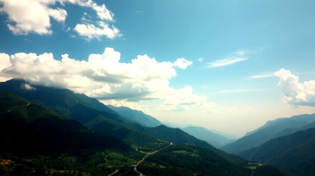Mountain landscape with clouds and blue sky. Panoramic view.