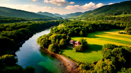 Aerial view of a small house on the bank of the riverの写真素材