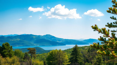 Beautiful landscape with mountains, lake, forest and blue sky.の写真素材