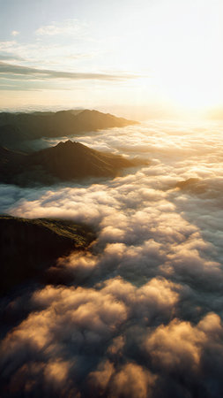 Aerial view of clouds and fog in the mountains at sunrise.の写真素材