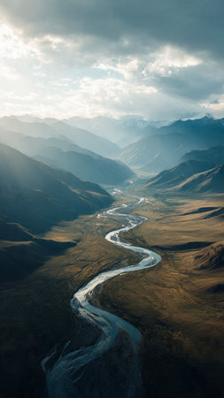 Mountain landscape with a river in the valleyの写真素材