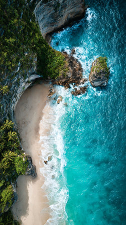 Aerial view of beautiful tropical beach with turquoise water and rocks