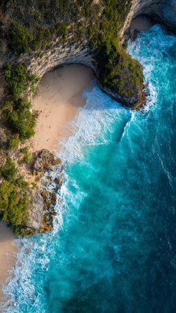 Aerial view of a beautiful beach with turquoise water and rocksの写真素材