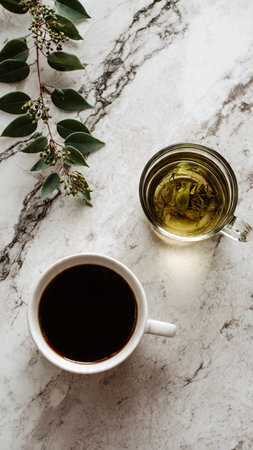 Cup of black coffee and eucalyptus branchle backgroundの写真素材