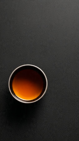 Japanese tea in a cup on a black background. Top view.の写真素材