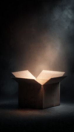Wooden box with light coming out from it on a dark backgroundの写真素材