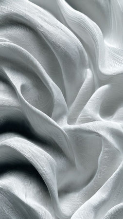 white satin fabric texture background, abstract wavy folds of clothの写真素材