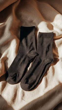 pair of socks on a beige fabric background, close-upの写真素材