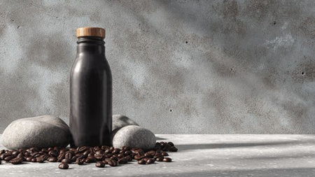coffee beans and a bottle of black coffee on a gray backgroundの写真素材