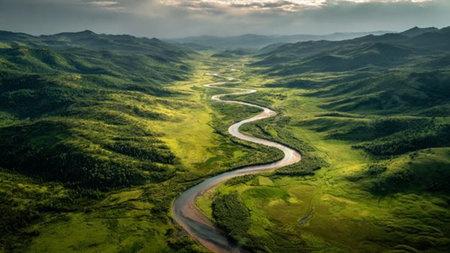 Aerial view of the winding river in the mountains at sunset.の写真素材