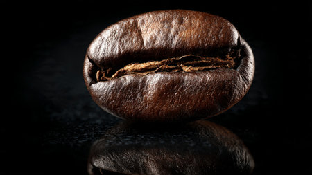 roasted coffee beans on a black background with reflection, close-up