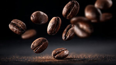 Flying coffee beans on a black background. Roasted coffee beans on a black background.