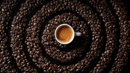 Cup of coffee and coffee beans on a dark background, top viewの写真素材
