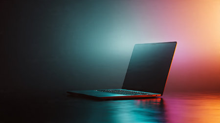 Laptop on a table in a dark room with neon lights.