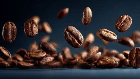 Flying coffee beans on a dark background. Flying coffee beans on a dark background.