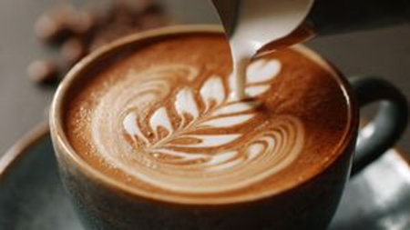 Coffee latte art. Latte art in a cup