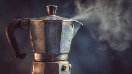 Coffee maker with smoke on a dark background. Toned.の写真素材