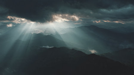 Panorama of the mountains and the sun's rays through the clouds