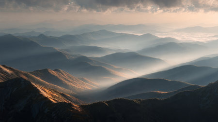 Beautiful landscape of mountains covered with fog at sunrise. Carpathians, Ukraine