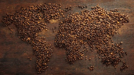 Coffee beans on rustic wooden background, top view.
