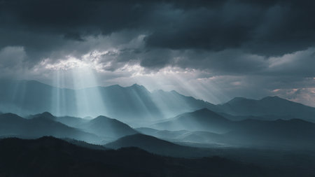 Mountain landscape with dramatic sky and sunbeams through the clouds