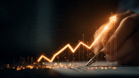 A polished desk setup with market analytics, printed documents, and hot beverage.の写真素材